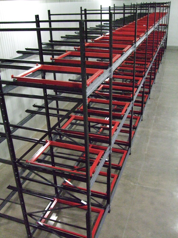 Push back pallet rack carts and rails in a cold storage room