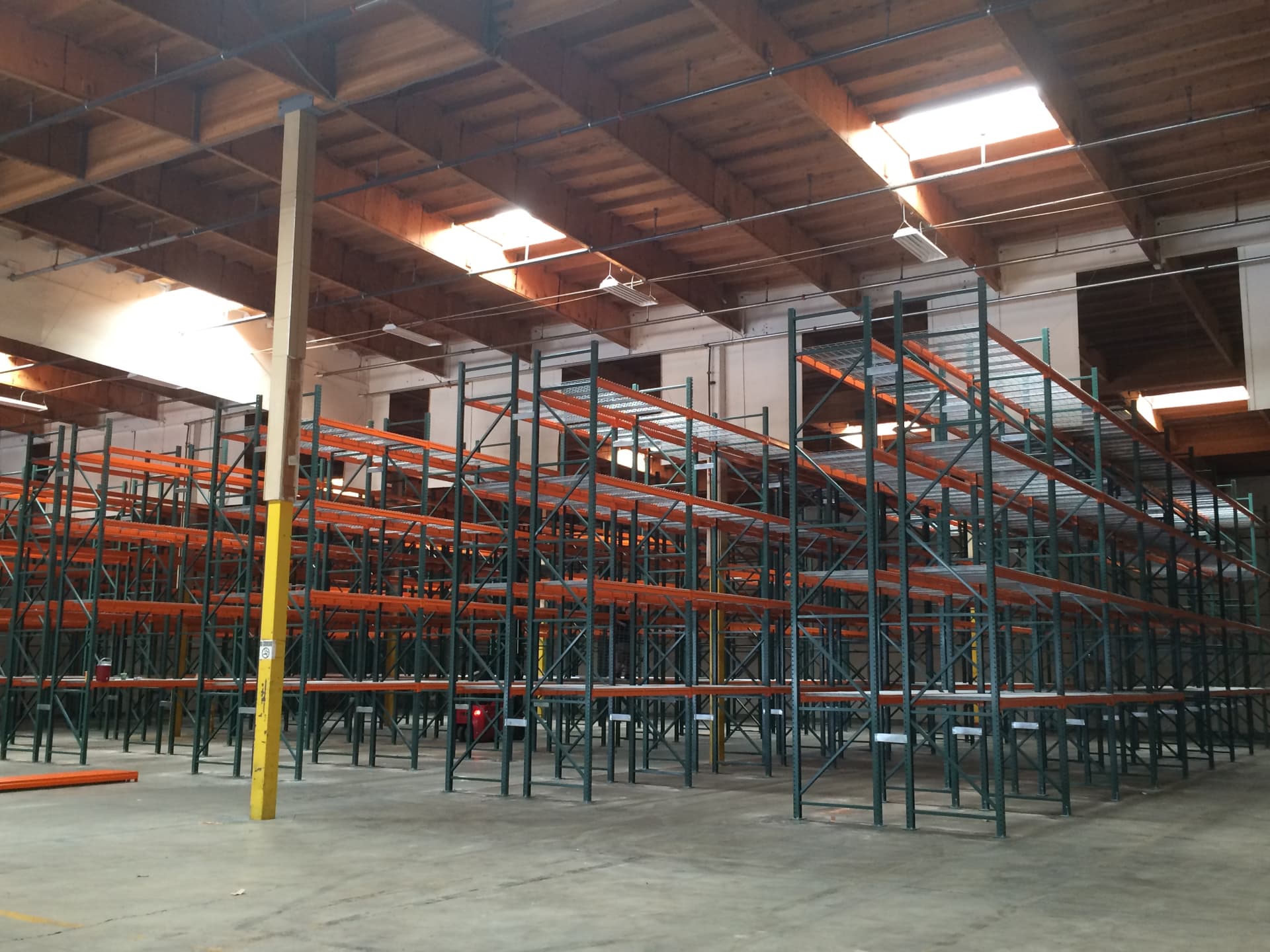 Pallet rack rows installed across a warehouse floor